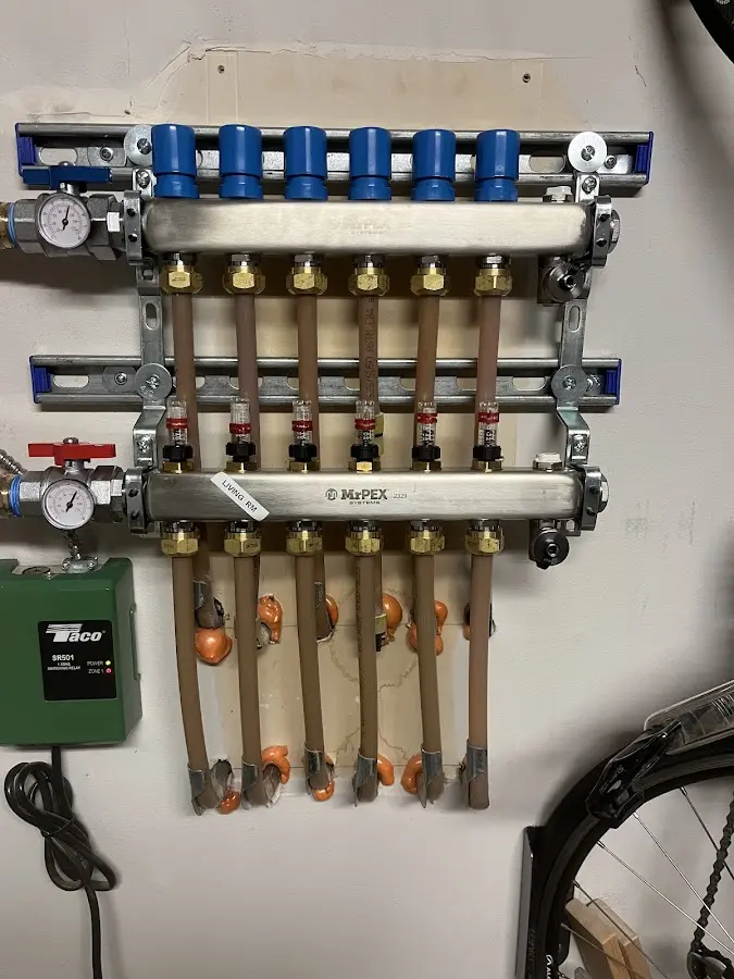 Plumber performing Water Heater Repair at a residential property in Friendswood